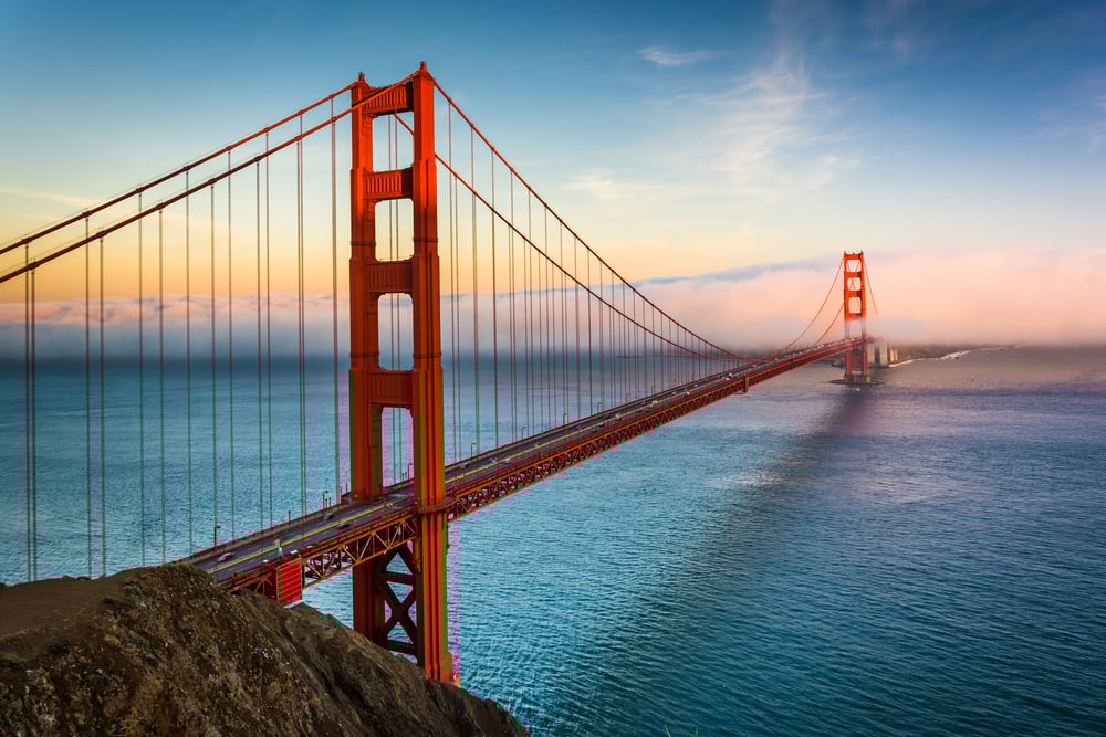 Sunset view of the Golden Gate Bridge and fog from Battery Spencer, Golden Gate National Recreation Area, in San Francisco, California. Sunset view of the Golden Gate Bridge and fog from Battery Spencer, Golden Gate National Recreation Area, in San Francisco, California.